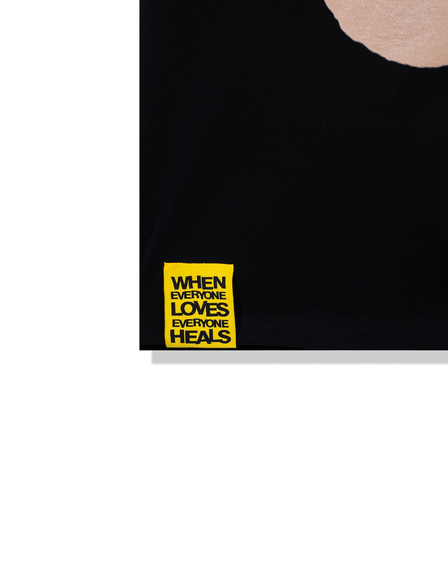 Black t-shirt with yellow text on a white background