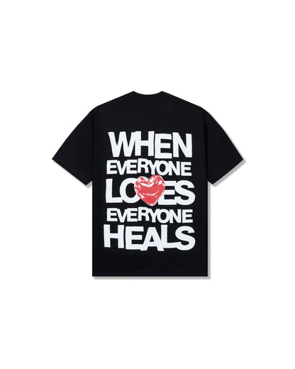 Black t-shirt with white text and a red heart on a white background